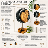 Handgefertigte drehbare Skulptur aus Olivenholz und metallic-anthrazitfarbenem Epoxidharz auf Holzsockel. Detailbild mit Größenangaben, Materialinformationen und Nahaufnahmen der einzigartigen Olivenholzmaserung. Modernes Dekoobjekt, ca. 14 cm Durchmesser und 27 cm Höhe, jedes Stück ein Unikat.